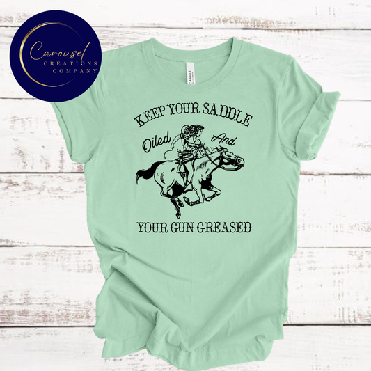 Keep Your Saddle Oiled, and Your Gun Greased Tee